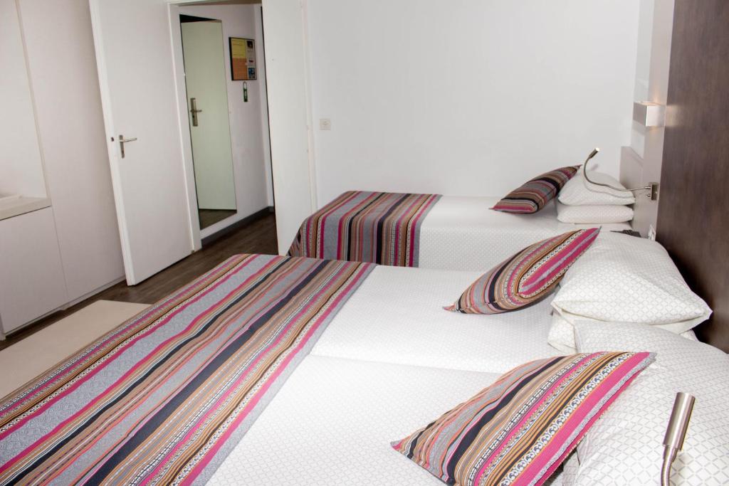 Cama o camas de una habitación en Colorado Hotel