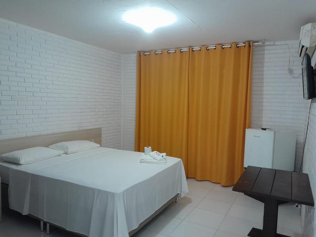 Postel nebo postele na pokoji v ubytování Hotel Sambura