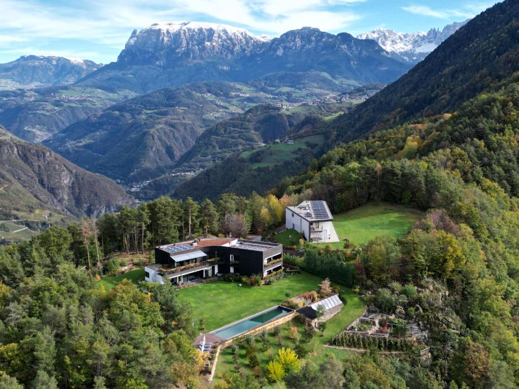an aerial view of a house in the mountains at VILLA COLLINA VERDE in Bolzano