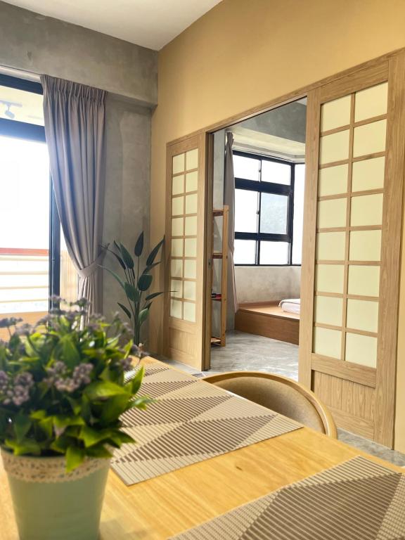 a dining room with a table and a mirror at Genting View Resort Duplex Penthouse 5R4B 17pax by Jen.dehome in Genting Highlands