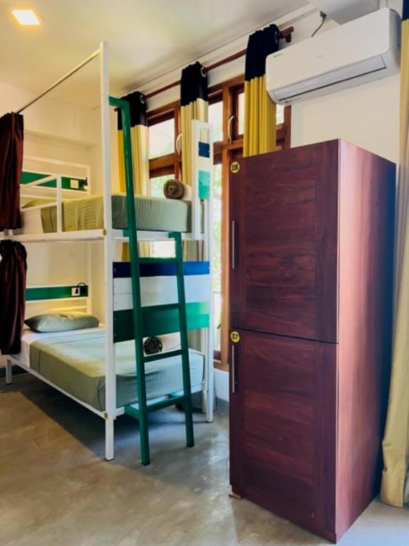 Postel nebo postele na pokoji v ubytování Downtown Hostels Ella