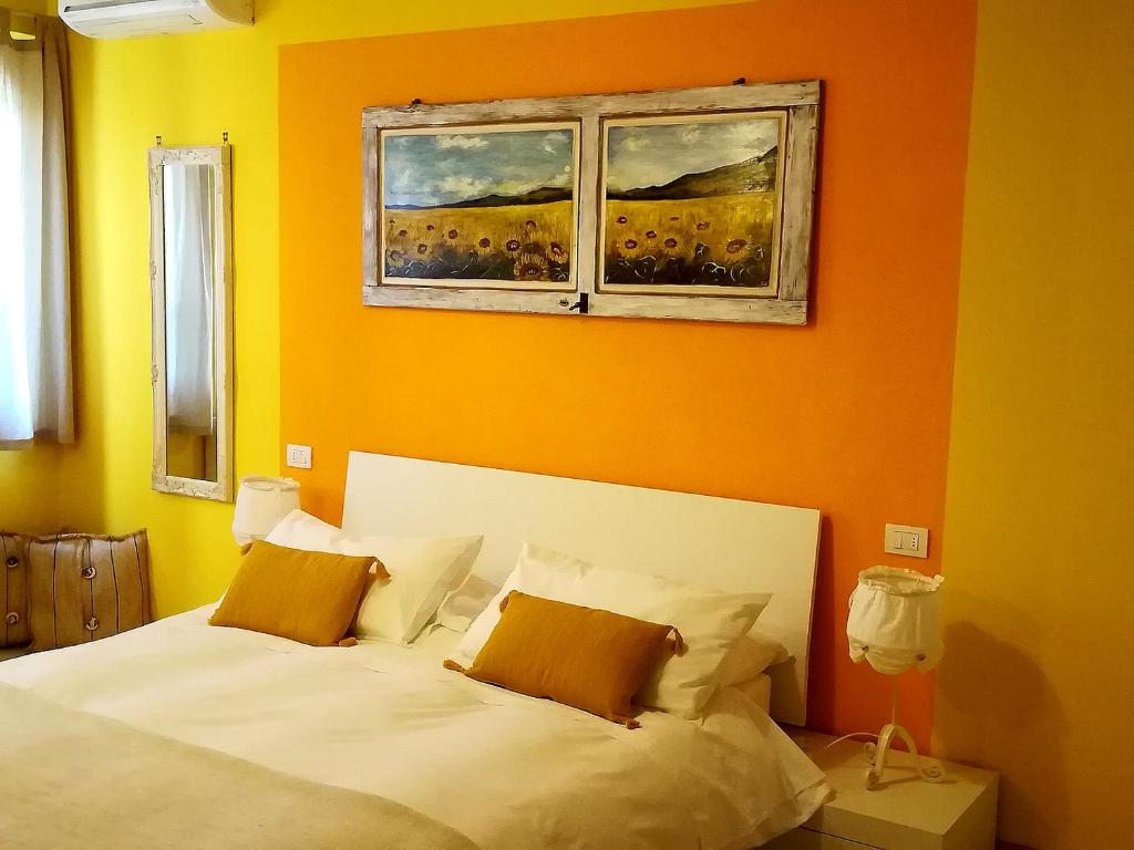 Postel nebo postele na pokoji v ubytování Agriturismo La Dependance
