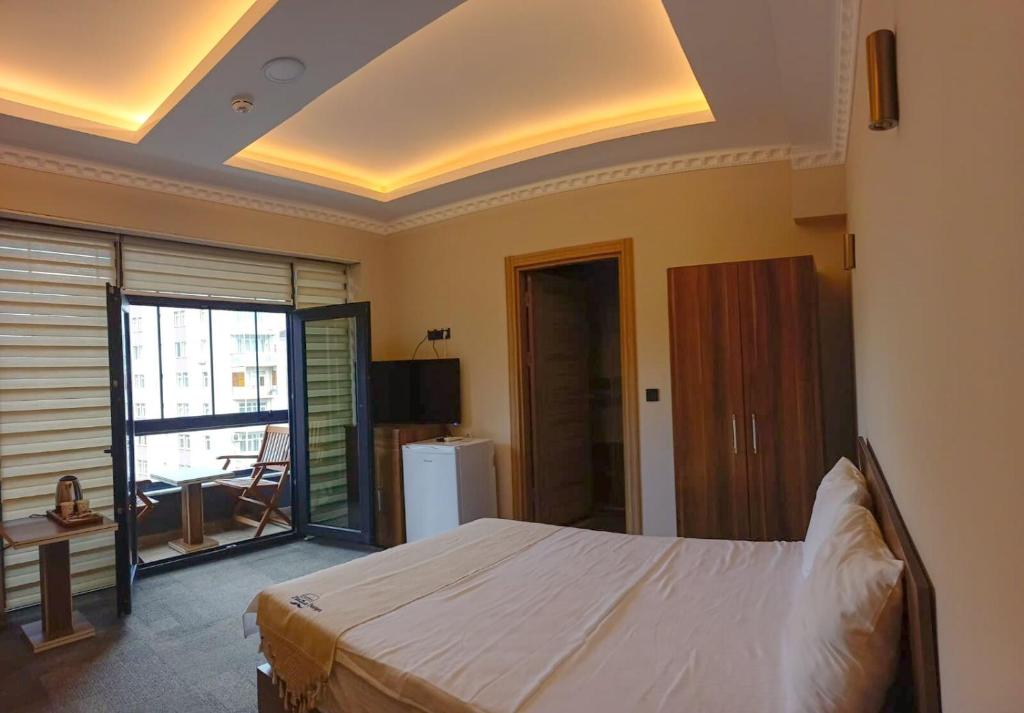 Postel nebo postele na pokoji v ubytování Osmanlı Paşa Otel- Konaklama