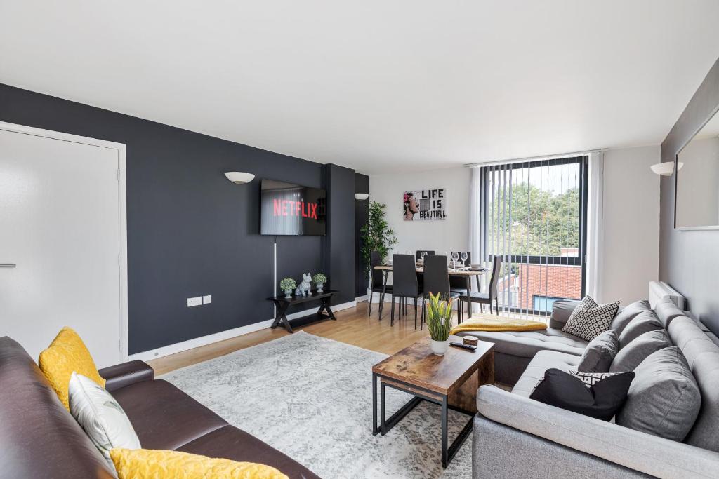 a living room with a couch and a table at King's Cross Cabin in London