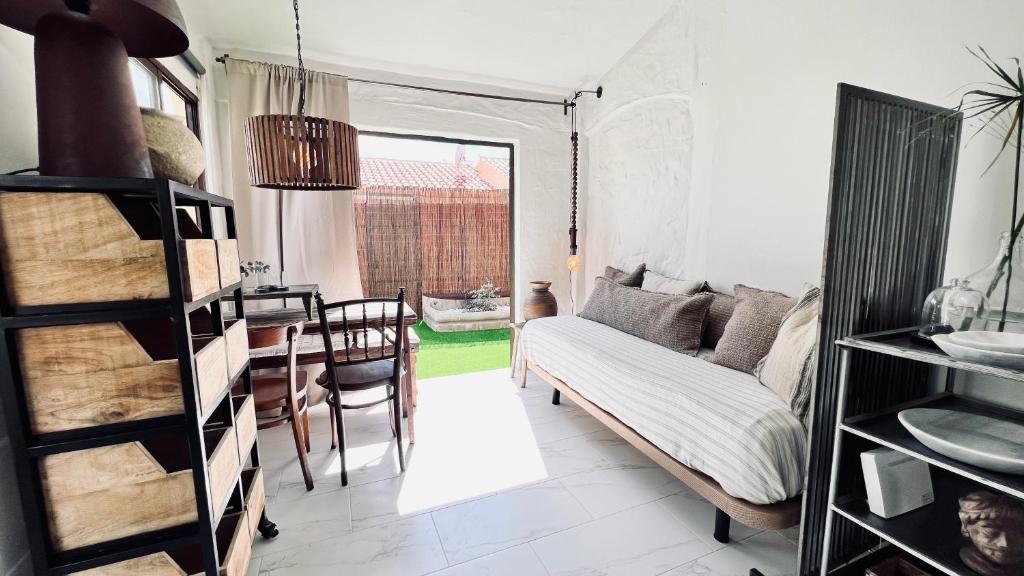 a living room with a couch and a table at Casa Boutique Luxury Yumbo in Playa del Ingles