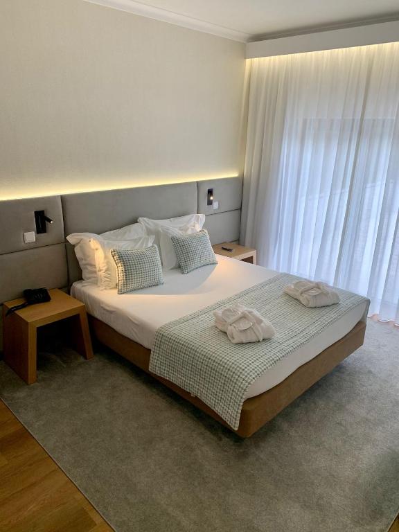 Postel nebo postele na pokoji v ubytování Hotel Lara