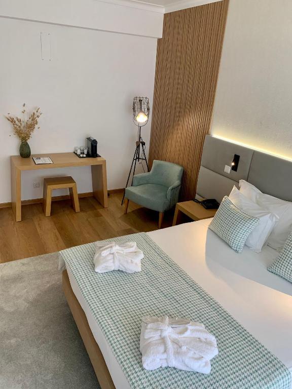 Postel nebo postele na pokoji v ubytování Hotel Lara