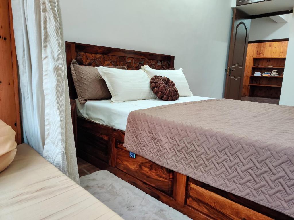 Postel nebo postele na pokoji v ubytování The Rustic Manor - Homestay