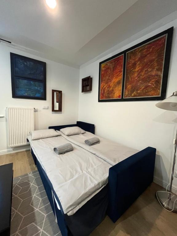 a bedroom with a large bed in a room at U Filipa in Gdynia