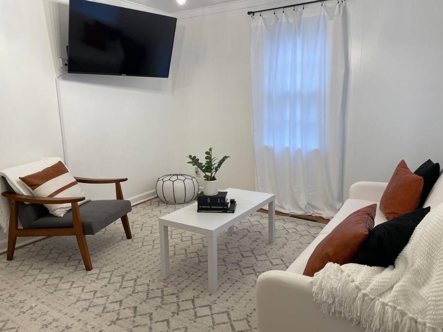 a living room with a couch and a table at Pet Friendly, 30+ Night Stay in Johnson City