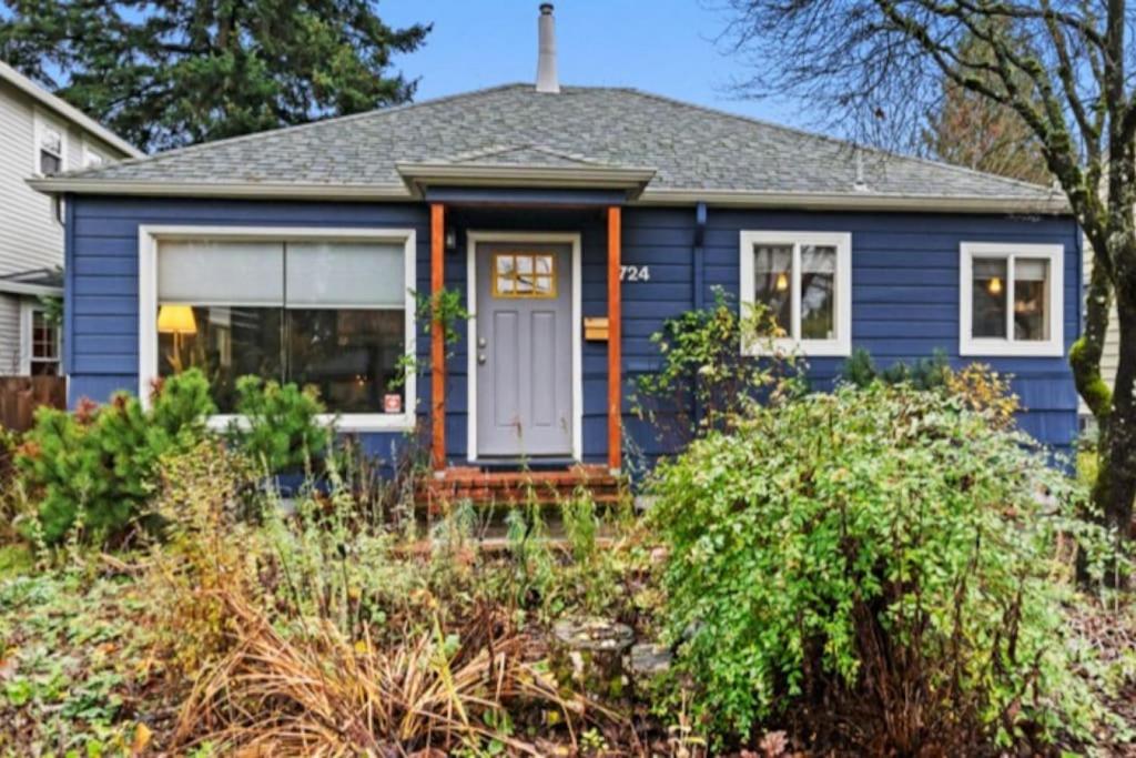 a blue house with a white door at Casa Azul Near Alberta Arts - Dog Friendly in Portland