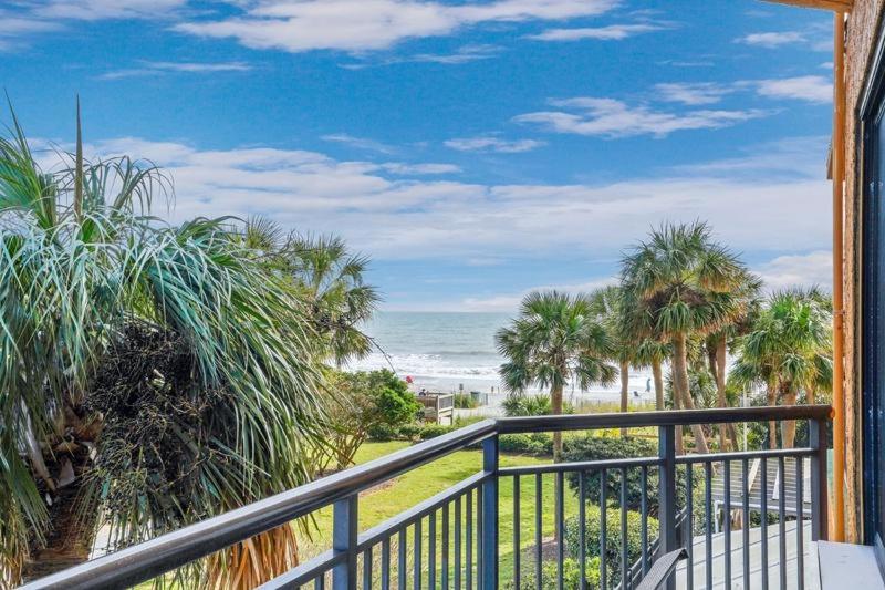 a balcony with a view of the beach and the ocean at Beautiful, Beachy decor, Ocean View, breathtaking, wifi included in Myrtle Beach