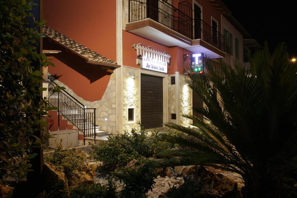 a building with a sign on it at night at Casa Magini in Settecamini