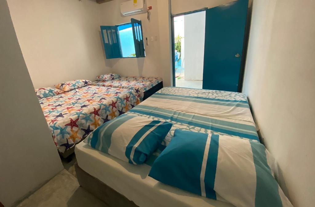 Postel nebo postele na pokoji v ubytování Casa Santorini
