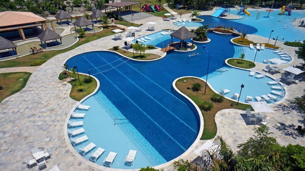an overhead view of a swimming pool at a resort at Iloa Residence Apt Premium -Quarto e sala climatizado in Barra de São Miguel
