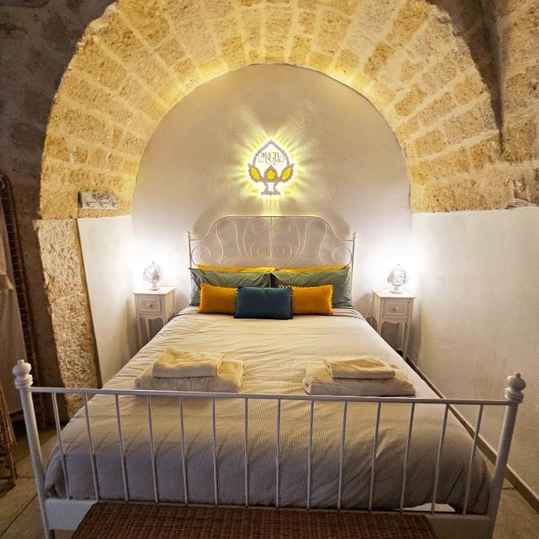 Postel nebo postele na pokoji v ubytování Dimora Il Pumo