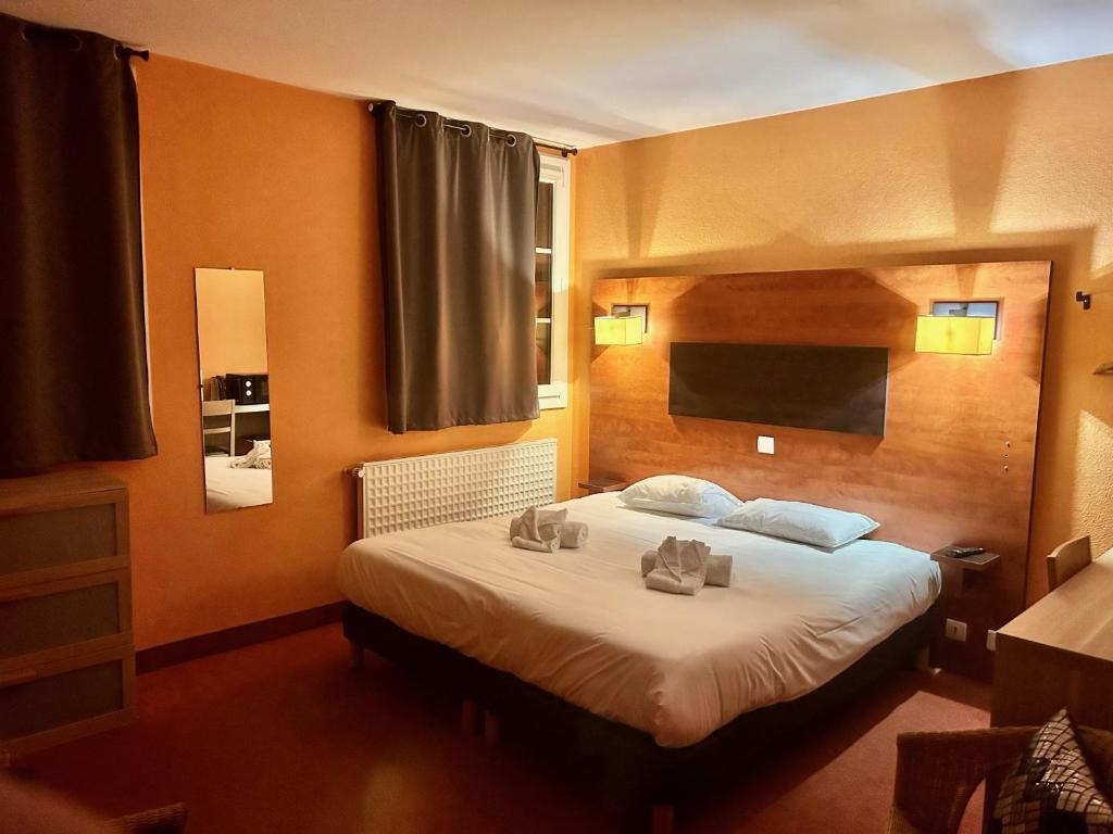 En eller flere senger på et rom på Hôtel Particulier LE MAS DES MARAIS