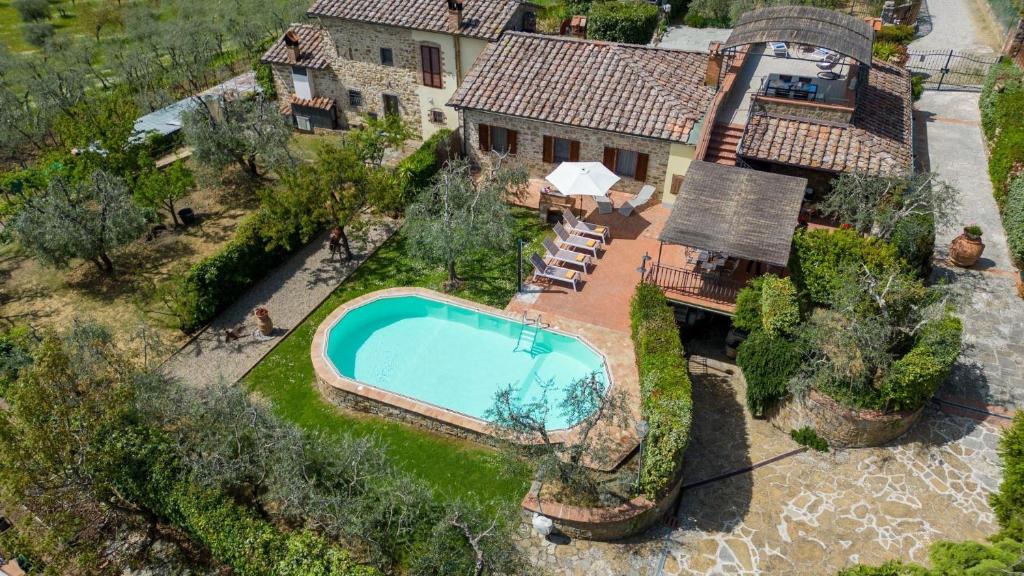 an aerial view of a house with a swimming pool at Angolino in Radda in Chianti