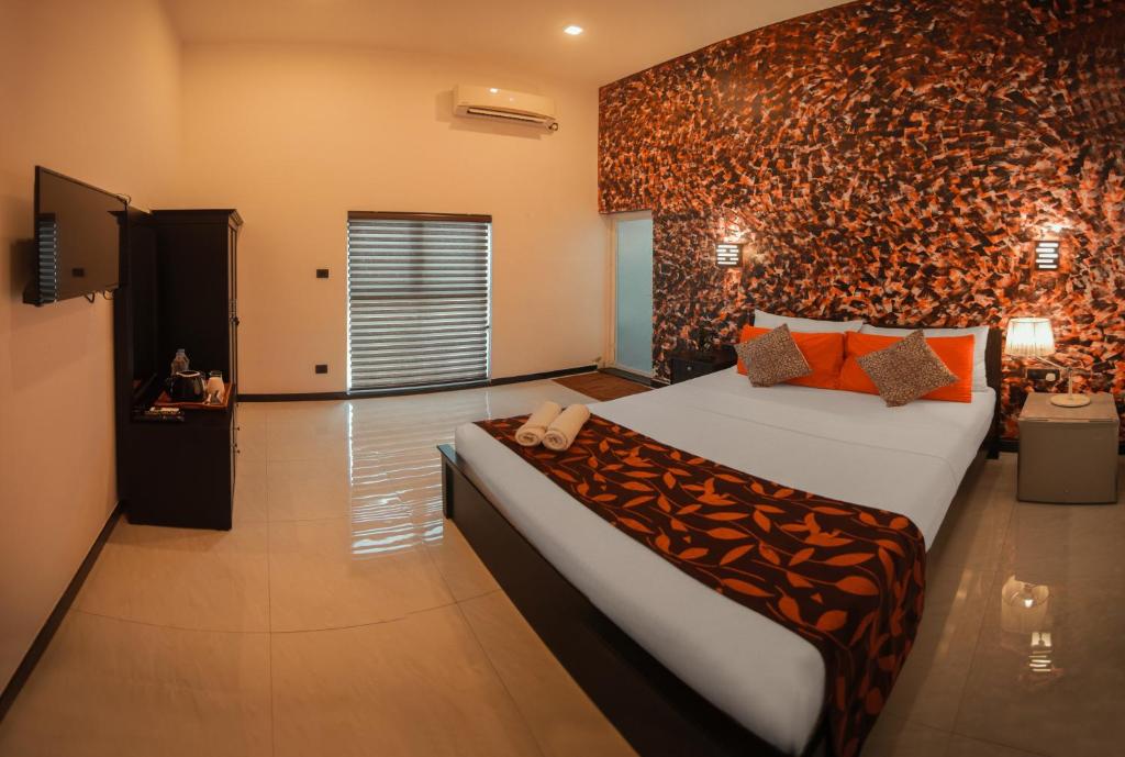 Postel nebo postele na pokoji v ubytování D Plus B&B Negombo