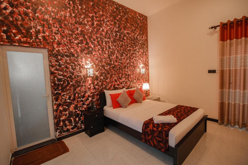 Postel nebo postele na pokoji v ubytování D Plus B&B Negombo