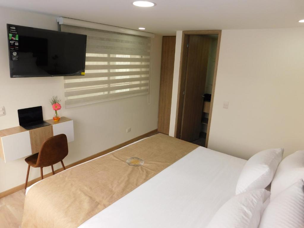 TV a/nebo společenská místnost v ubytování HOTEL MX BOGOTA
