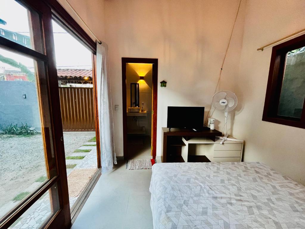 Postel nebo postele na pokoji v ubytování Casa com quintal