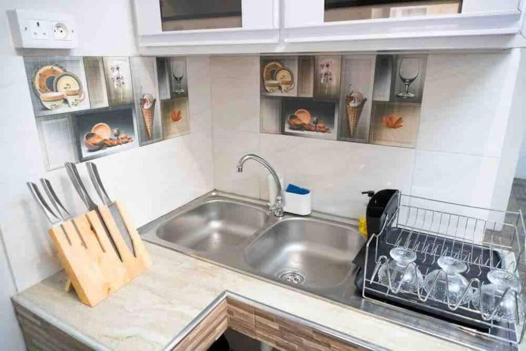Kuchyň nebo kuchyňský kout v ubytování Vythee Residence