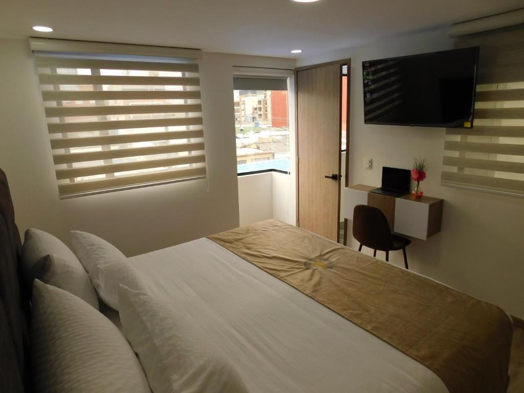TV a/nebo společenská místnost v ubytování HOTEL MX BOGOTA