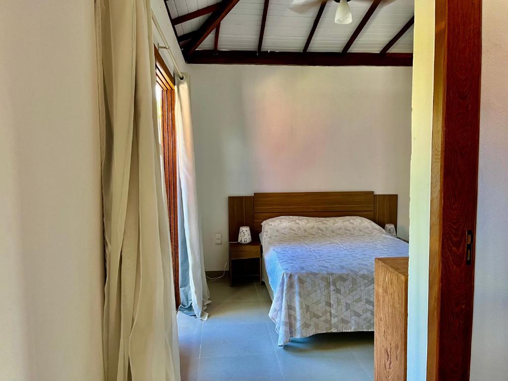Postel nebo postele na pokoji v ubytování Casa com quintal