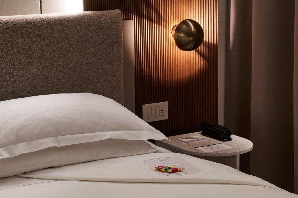 Postel nebo postele na pokoji v ubytování Adriatic Palace Hotel