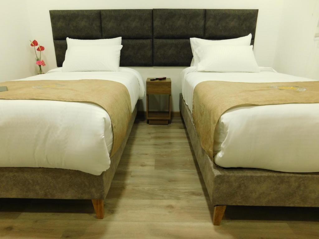 Postel nebo postele na pokoji v ubytování HOTEL MX BOGOTA