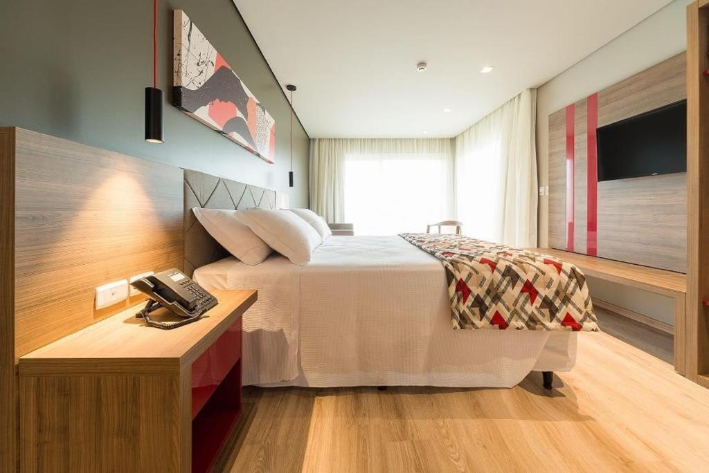 TV a/nebo společenská místnost v ubytování Hotel Laghetto Stilo Borges apt 318