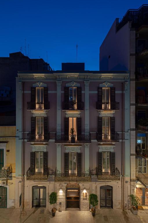 a large building with balconies on the side of it at VIS urban suites & spa - Boutique Hotel in Bari