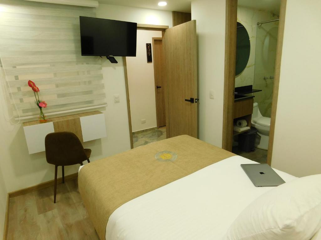 TV a/nebo společenská místnost v ubytování HOTEL MX BOGOTA