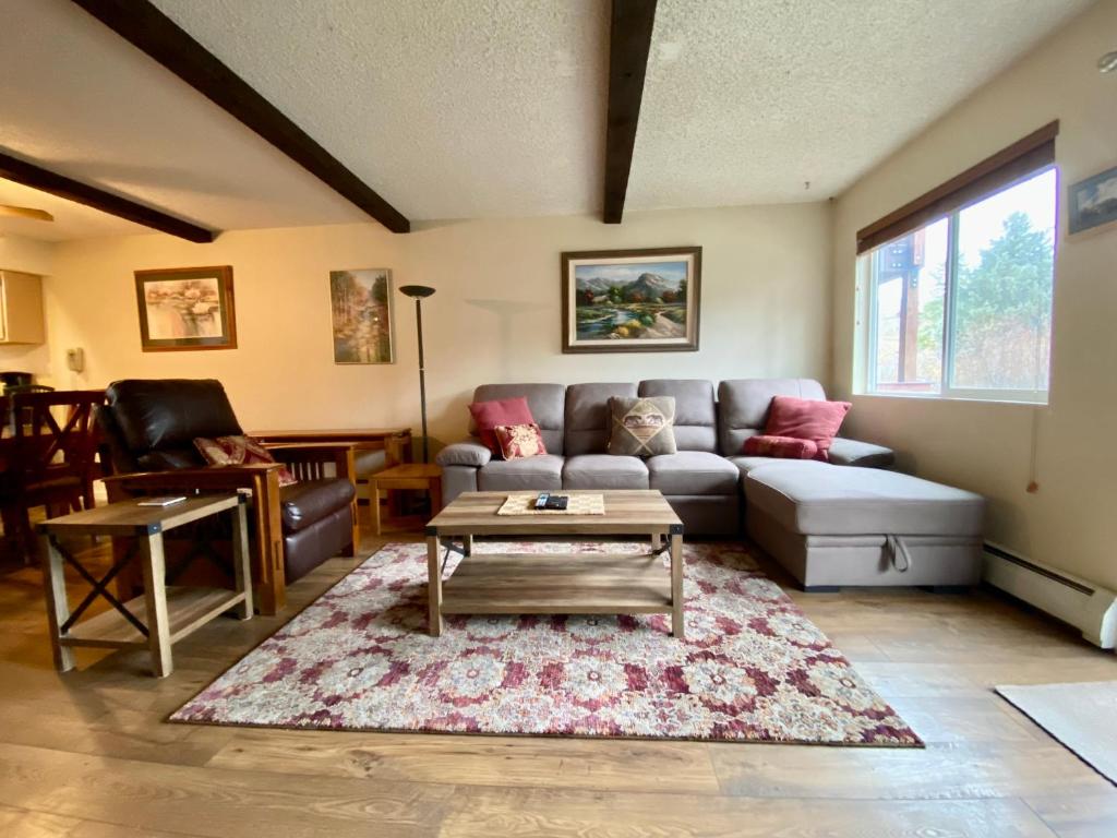 a living room with a couch and a coffee table at Hi Country Haus Unit 1803 in Winter Park