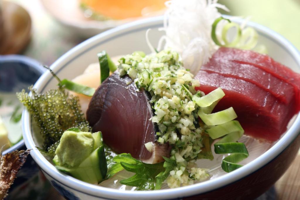 a bowl of food with meat and vegetables on a table at Teiensaryo Yamanakako in Yamanakako