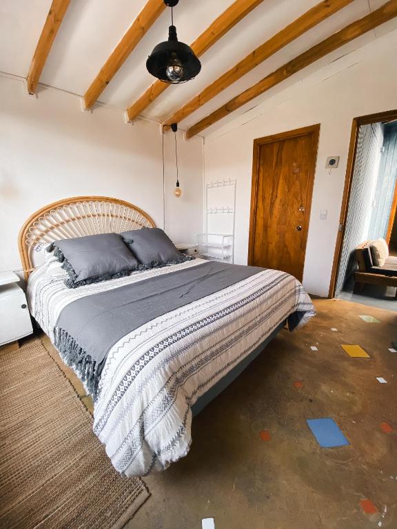 Postel nebo postele na pokoji v ubytování Malibu Hostal Boutique