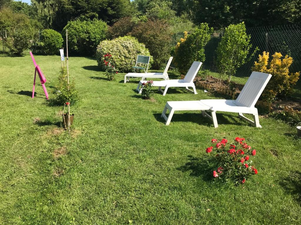a row of white chairs sitting in the grass at Chelles - Paris - Disneyland Marne la vallée in Chelles