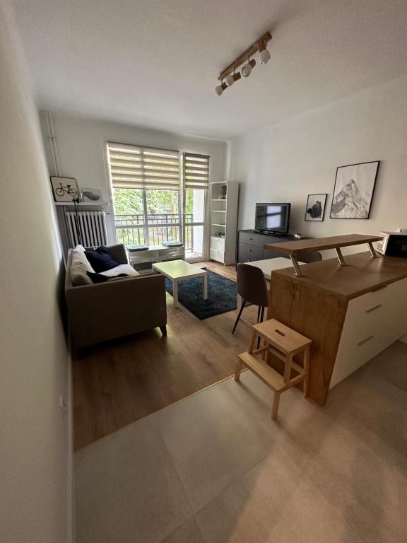 a living room with a couch and a table at Downtown Apartment Murano in Warsaw