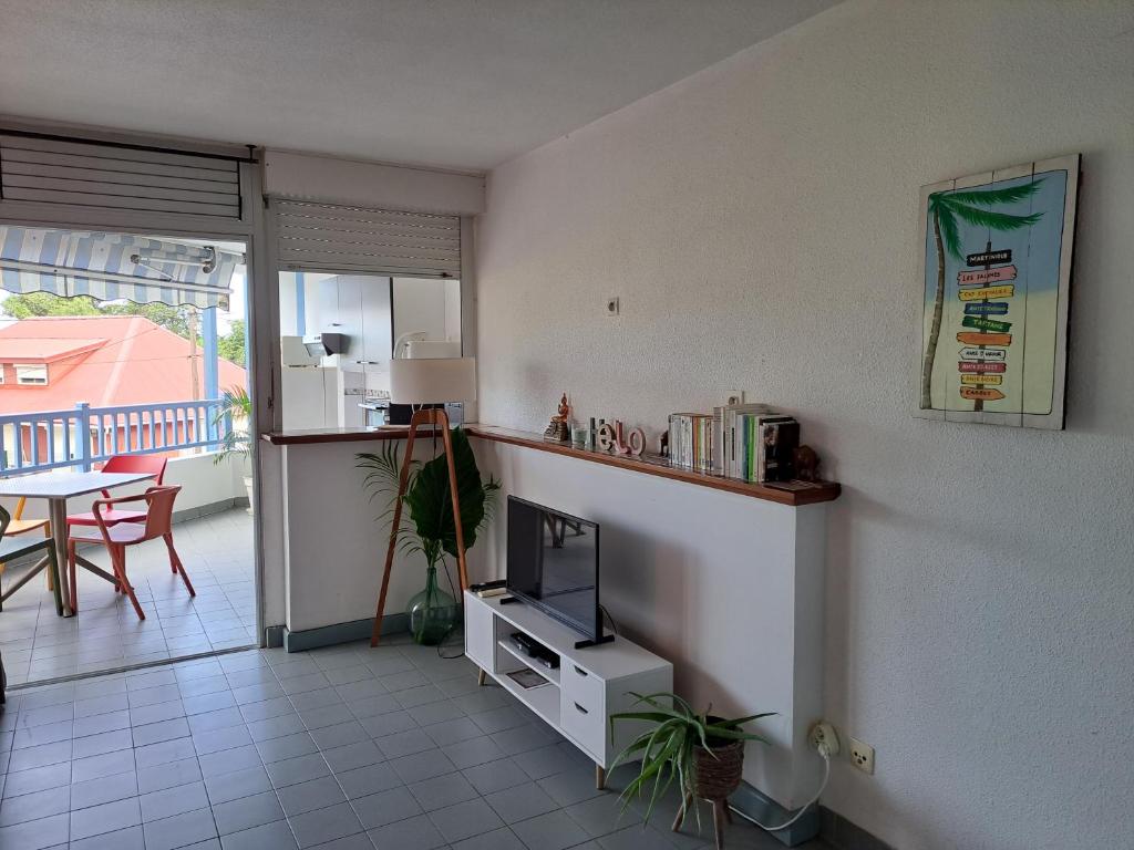 Kuchyň nebo kuchyňský kout v ubytování Appartement cosy en résidence à deux pas de la mer