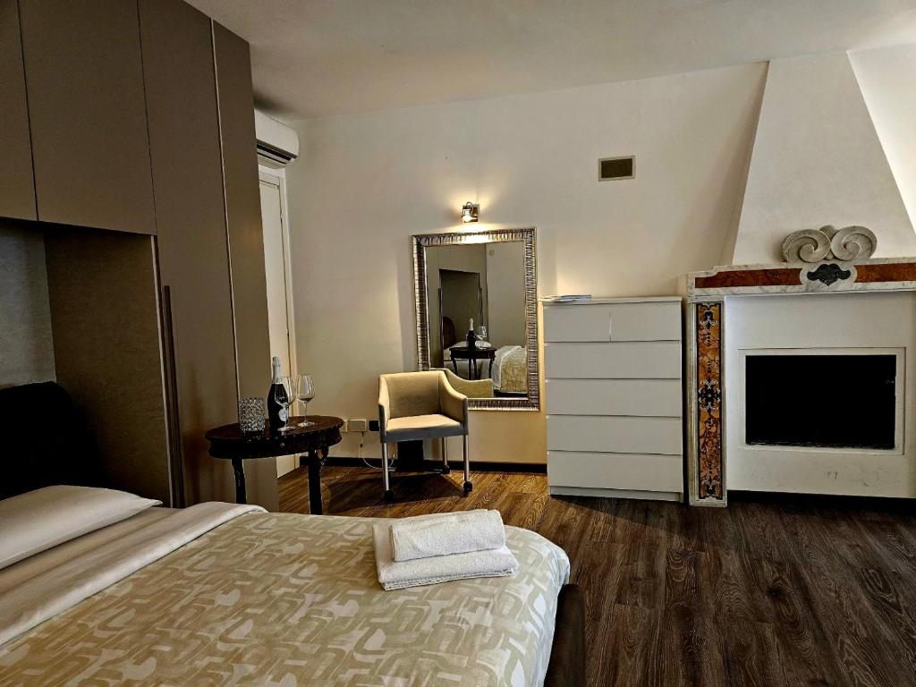 a bedroom with a bed and a dresser and a mirror at Heart of Brera in Milan