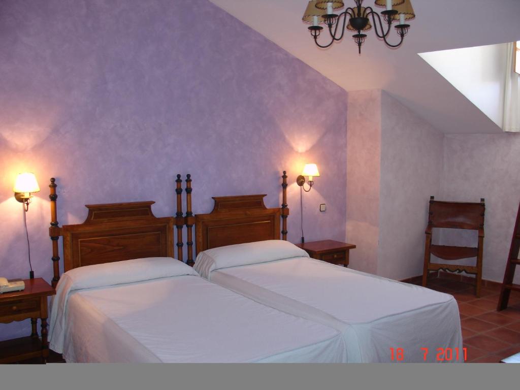 Postel nebo postele na pokoji v ubytování Hotel Las Cancelas