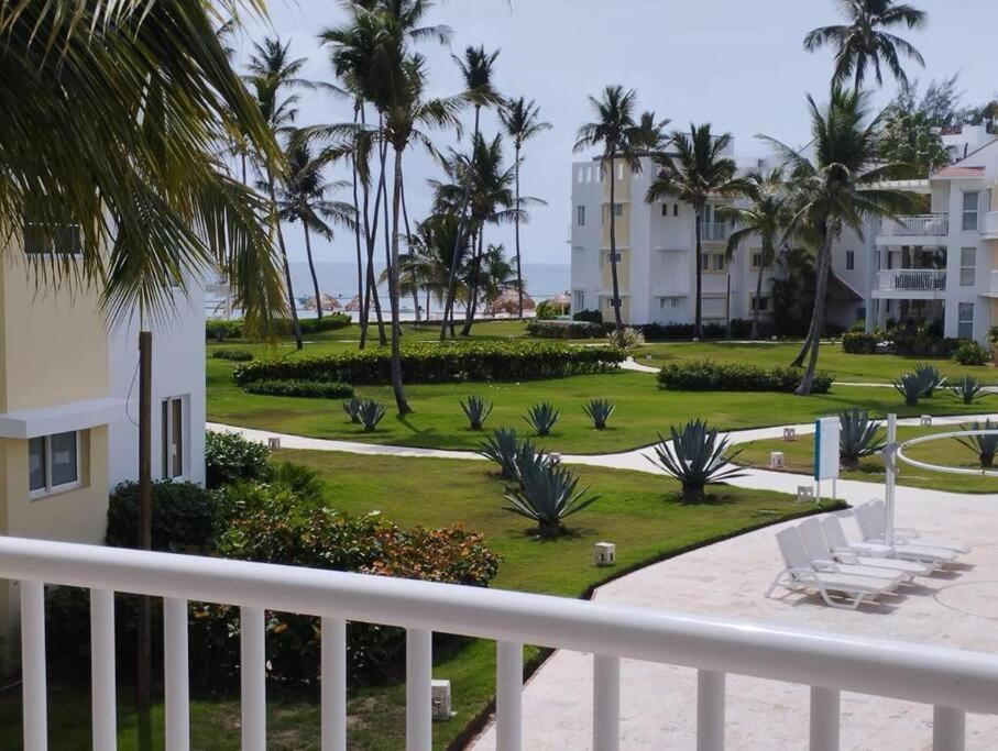 a view from the balcony of a resort at Oceanfront Playa Turquesa with highspeed Wi-Fi, pools, free beach access in Punta Cana