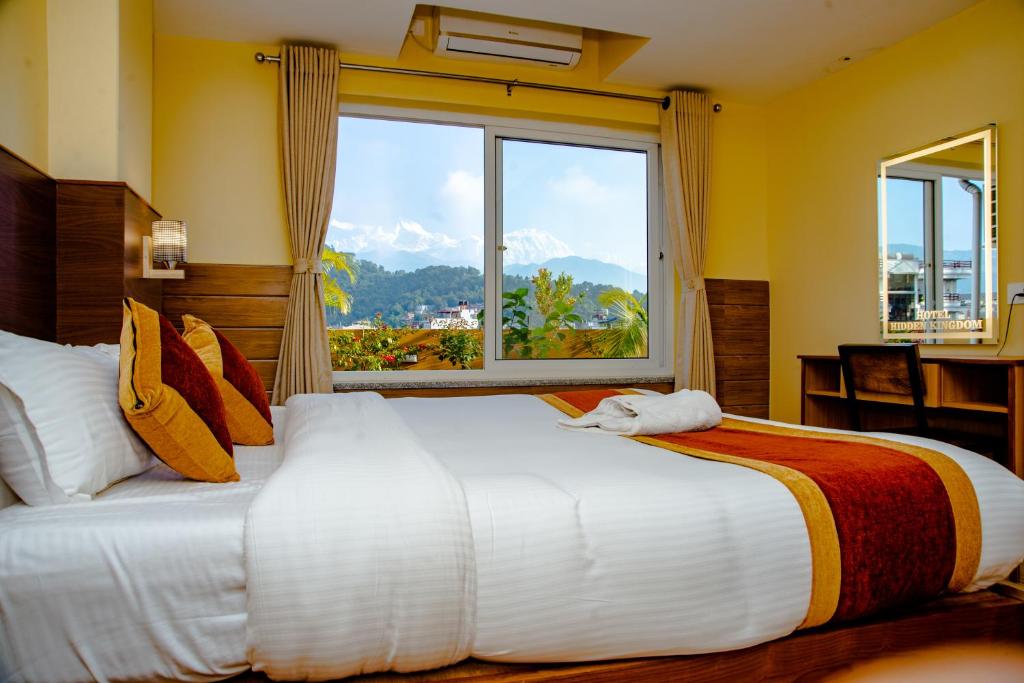 A bed or beds in a room at Hotel Hidden Kingdom