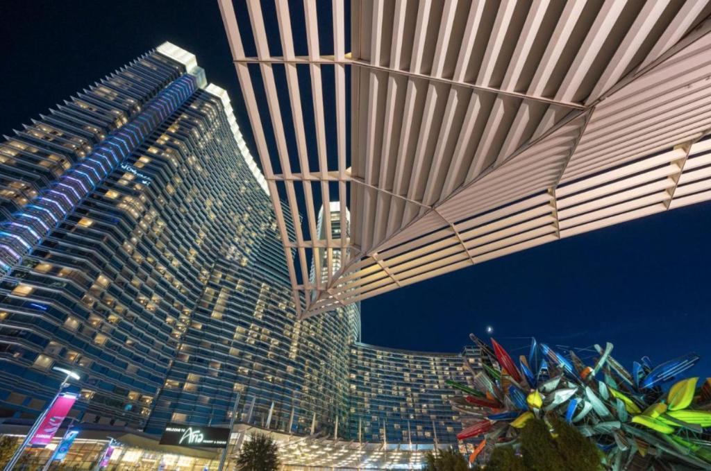 a large tall building with lights on in front of it at VDARA HOTEL Premium Studio Suite * FREE VALET PARKING in Las Vegas