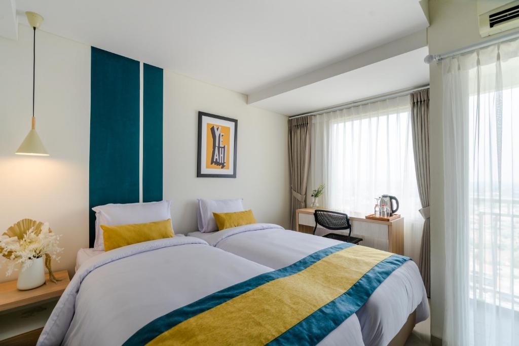 Ένα ή περισσότερα κρεβάτια σε δωμάτιο στο Hotel Dhika Serenity @ Jatiwarna