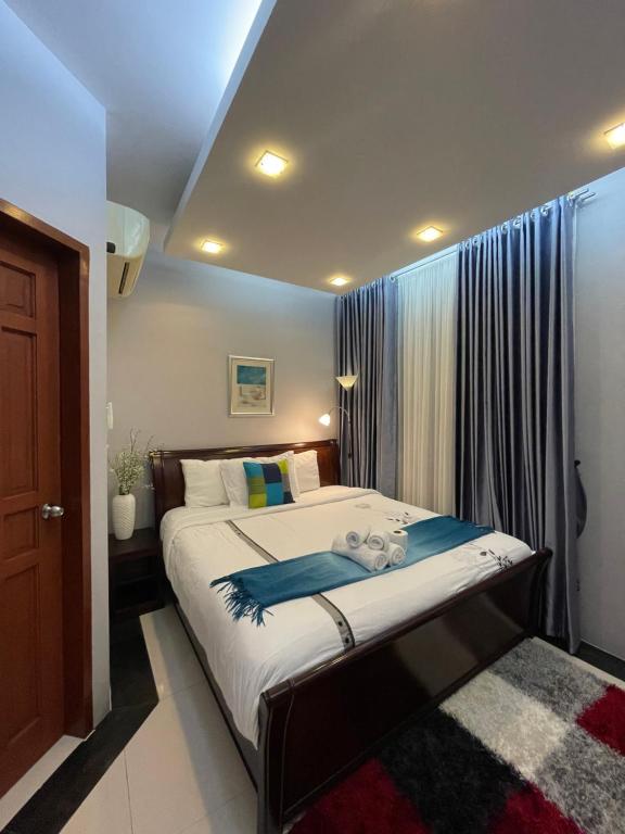 Postel nebo postele na pokoji v ubytování Anavada Suites - Davao City