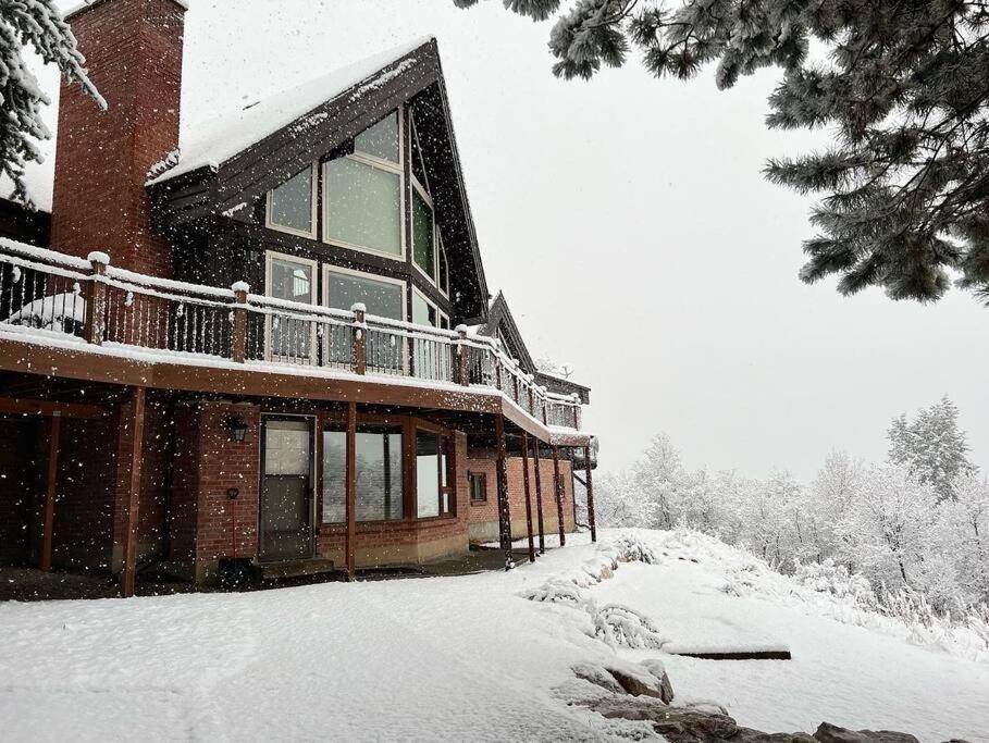 a large building with snow on the side of it at Snowbasin + Powder Mountain + Spa + Eden in Eden