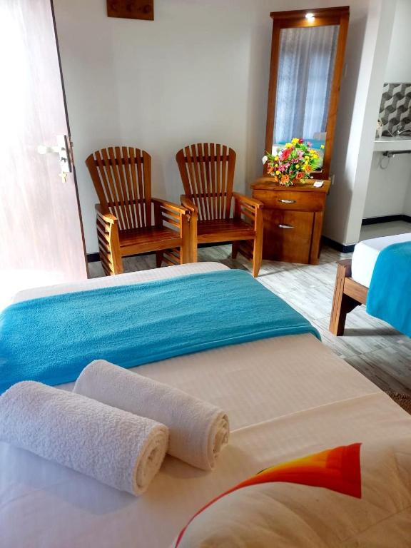 Postel nebo postele na pokoji v ubytování Dinu Lanka Resort