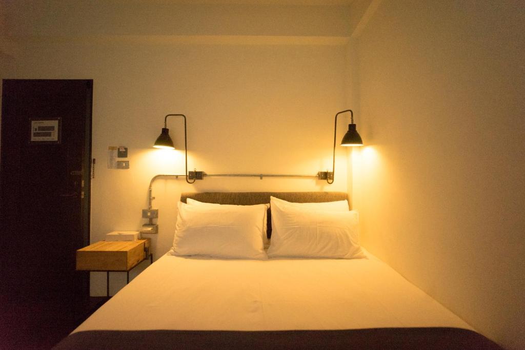 Postel nebo postele na pokoji v ubytování 未艾公寓WeLove Apartment